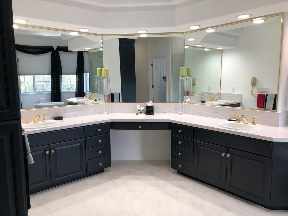 Lots of mirror, quarts counters and a makeup niche make this master bathroom an oasis for relaxation.