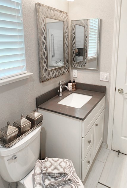 Decorative vanity with easy to operate single lever faucet, solid surface countertop and undermount sink.