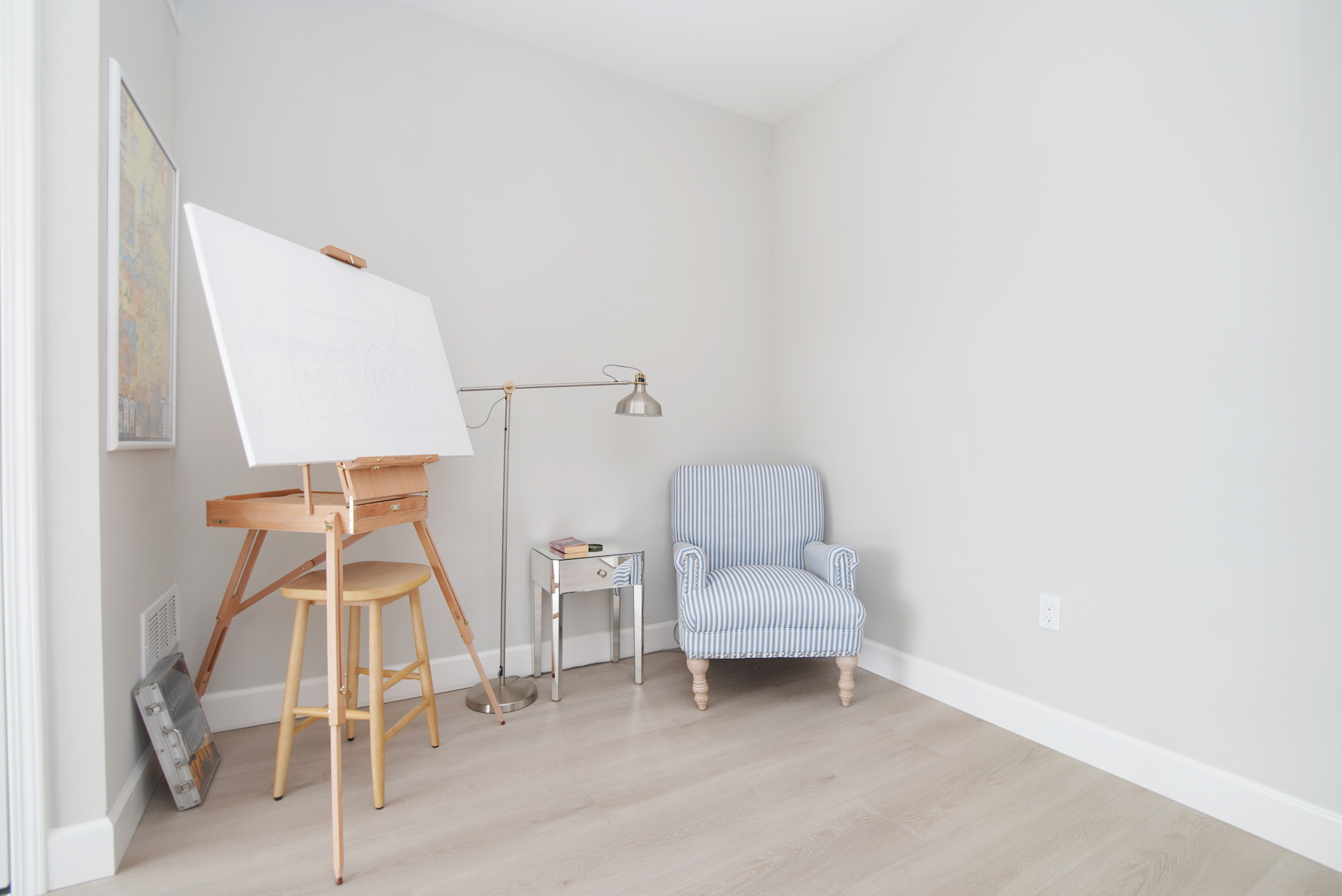 small art area with a canvas and chair