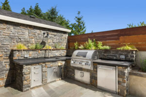 Backyard hardscape entertainment area with grill