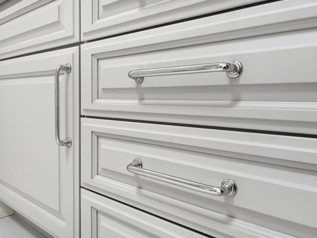 white drawers with metal handles