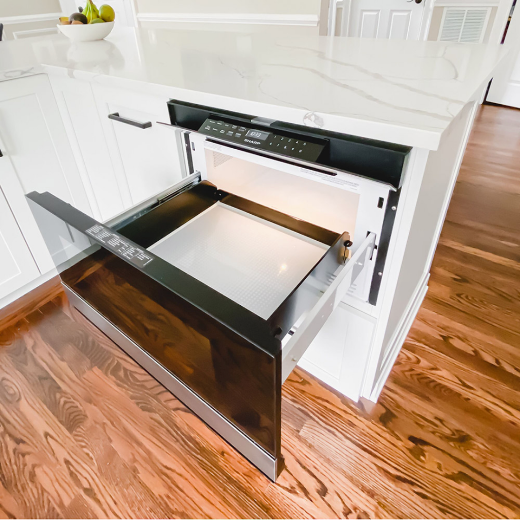 Custom microwave inside modern home's kitchen table