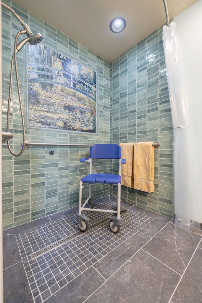 green and blue tile walk in shower