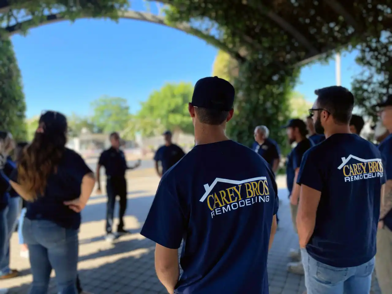 Carey Bros. employees in a circle at an outdoor teambuilding