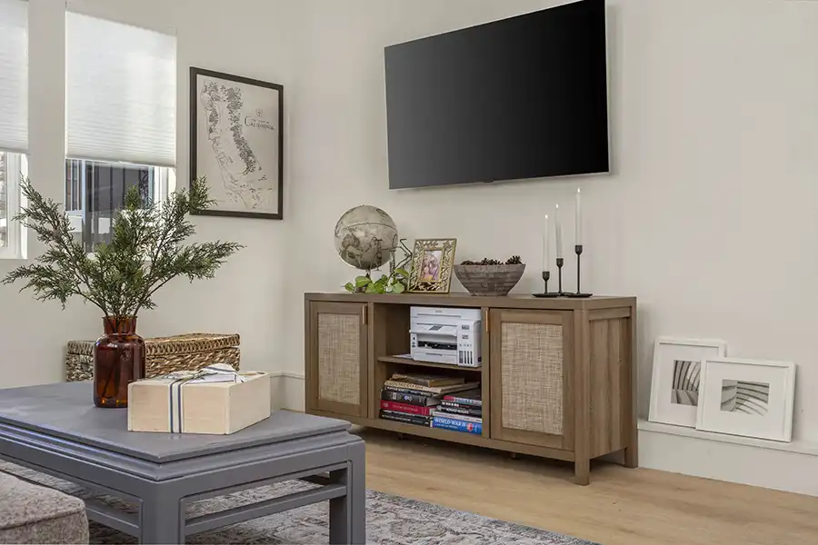 02 ARCH Cream walls, light wood plank flooring, white window coverings, mini-split hvac, light colored window coverings