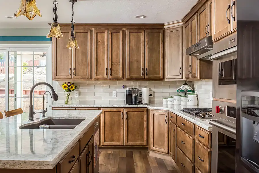 03 YellowoodPl_CareyBros01 Custom cabinetry with a clean, transitional profile, Large center island, Durable quartz or stone countertops with eased edges, Tile backsplash extending to the underside of upper cabinets, Energy-efficient appliances integrated into the cabinetry layout, task and ambient lighting with dimmable controls, Pantry storage