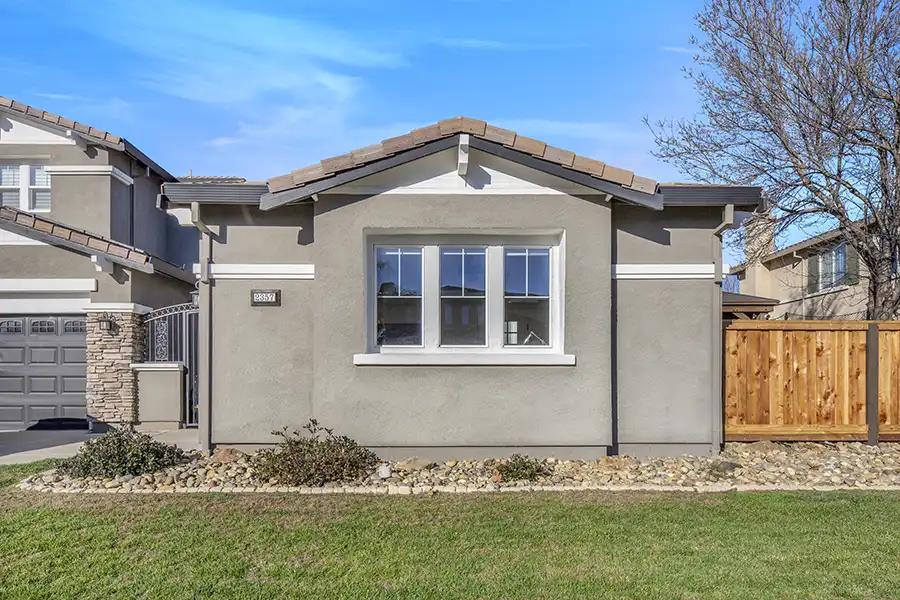 05 ARCH Exterior: Cream walls, light wood plank flooring, white window coverings, mini-split hvac, light colored window coverings