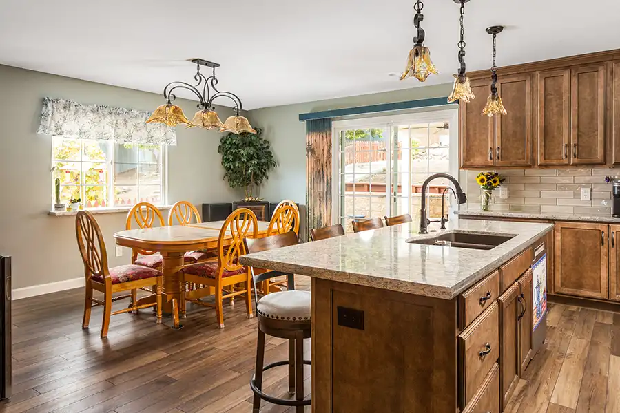 05 YellowoodPl_CareyBros4 Custom cabinetry with a clean, transitional profile, Large center island, Durable quartz or stone countertops with eased edges, Tile backsplash extending to the underside of upper cabinets, Energy-efficient appliances integrated into the cabinetry layout, task and ambient lighting with dimmable controls, Pantry storage