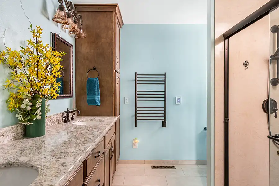 09 YellowoodPl_CareyBros11 Curbless or low-threshold shower with full-height tile, Pressure-balance or thermostatic shower controls, Floating or furniture-style vanity with stone countertop, Water-efficient fixtures compliant with California codes, Thoughtful lighting for both task and ambiance, Slip-resistant flooring selected for safety and durability